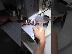 Button fixing machine